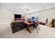 Spacious living room area with an oversized sofa, desk and office area at 410 Gardens Of Harmony Dr, Canton, GA 30115