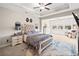 Spacious main bedroom featuring a tray ceiling, large windows, and a sitting area at 410 Gardens Of Harmony Dr, Canton, GA 30115