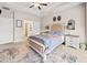 Comfortable main bedroom showcasing a decorative headboard, and ensuite bathroom access at 410 Gardens Of Harmony Dr, Canton, GA 30115