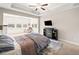 Serene main bedroom with a fireplace and an adjacent sitting area bathed in natural light at 410 Gardens Of Harmony Dr, Canton, GA 30115
