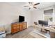 Office featuring hardwood floors, a ceiling fan and a large wooden dresser at 410 Gardens Of Harmony Dr, Canton, GA 30115