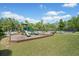 Community playground with slides near pool and tennis courts at 410 Gardens Of Harmony Dr, Canton, GA 30115
