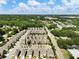Beautiful aerial view of a well-maintained neighborhood surrounded by lush green trees and a picturesque landscape at 4905 Sterling Close, Buford, GA 30518