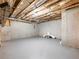 Unfinished basement with concrete walls, exposed ceiling joists, and painted floor at 4905 Sterling Close, Buford, GA 30518