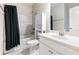 Bathroom with a white vanity, a tub-shower with tiled surround, and a toilet at 4905 Sterling Close, Buford, GA 30518