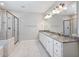 Bathroom with double vanity sinks, granite counters, a glass-enclosed shower, and tile floors at 4905 Sterling Close, Buford, GA 30518