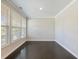 Clean and bright room with hardwood floors and windows bringing in natural light at 4905 Sterling Close, Buford, GA 30518