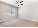 Neutral bedroom with carpet, a ceiling fan, a window with blinds, and ample natural light at 4905 Sterling Close, Buford, GA 30518