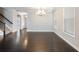 Dining room with hardwood floors is adjacent to staircase and multiple windows at 4905 Sterling Close, Buford, GA 30518