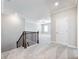 Upstairs hallway with neutral carpet and trim leading to the bedrooms at 4905 Sterling Close, Buford, GA 30518