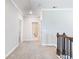 Bright hallway features plush carpet, neutral walls, with a laundry room in view at 4905 Sterling Close, Buford, GA 30518