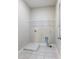 Laundry room with tile flooring, utility sink and built in shelving at 4905 Sterling Close, Buford, GA 30518