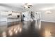 Spacious living area adjacent to the kitchen, featuring beautiful hardwood floors at 4905 Sterling Close, Buford, GA 30518