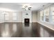 Spacious living room boasts a fireplace, fan, and generous windows for natural light at 4905 Sterling Close, Buford, GA 30518