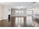 Spacious living room with fireplace and hardwood floors provides open, airy appeal at 4905 Sterling Close, Buford, GA 30518