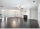 Spacious living room featuring hardwood floors, a fireplace, recessed lighting, and an open layout at 4905 Sterling Close, Buford, GA 30518