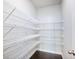 Walk-in pantry with wire shelving to maximize storage space for food and kitchen essentials at 4905 Sterling Close, Buford, GA 30518