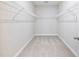 Empty walk-in closet with wire shelving and carpet at 4905 Sterling Close, Buford, GA 30518