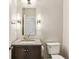 Powder room features stone vanity and ample lighting at 505 Ansley Villa Dr, Atlanta, GA 30324