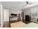 Bright bedroom featuring hardwood floors, ceiling fan, closet, and desk area with natural light at 505 Ansley Villa Dr, Atlanta, GA 30324