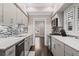 Updated kitchen with stainless appliances, white cabinets, and stylish backsplash at 505 Ansley Villa Dr, Atlanta, GA 30324