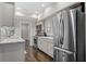 Modern kitchen with stainless steel appliances, marble countertops, and mosaic backsplash at 505 Ansley Villa Dr, Atlanta, GA 30324
