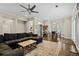 Spacious living area with hardwood floors, ceiling fan, and open floor plan to the kitchen at 505 Ansley Villa Dr, Atlanta, GA 30324