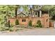 A lovely brick sign welcomes you to Ansley Monroe Villas with manicured landscaping at 505 Ansley Villa Dr, Atlanta, GA 30324