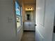 Bright bathroom boasts a white vanity with a granite countertop and a decorative lighting fixture at 508 Healy Dr # 70, Cumming, GA 30040