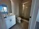 Bathroom features modern vanity, glass shower, tile floors, and contemporary fixtures at 508 Healy Dr # 70, Cumming, GA 30040