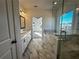 Open view from bathroom doorway with double vanity and large soaking tub at 508 Healy Dr # 70, Cumming, GA 30040