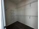 Empty walk-in closet with white shelving at 508 Healy Dr # 70, Cumming, GA 30040