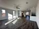 Expansive living room with hardwood floors connects to the kitchen and features lots of natural light at 508 Healy Dr # 70, Cumming, GA 30040