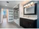 Updated bathroom with modern vanity, mosaic tile accent, glass shower, and modern sliding door at 115 W Peachtree Nw Pl # 713, Atlanta, GA 30313