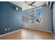 Bright bedroom with a ceiling fan and cityscape views from the expansive windows at 115 W Peachtree Nw Pl # 713, Atlanta, GA 30313