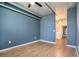 Bedroom featuring hardwood floors and a doorway to the laundry room at 115 W Peachtree Nw Pl # 713, Atlanta, GA 30313