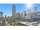 Stunning city view with high-rise buildings against a clear blue sky, showcasing the vibrant cityscape at 115 W Peachtree Nw Pl # 713, Atlanta, GA 30313