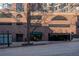 Attractive brick apartment building features a street view with parking garage and building entrance at 115 W Peachtree Nw Pl # 713, Atlanta, GA 30313