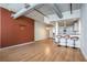 Spacious living room with hardwood floors, a modern kitchen, and exposed ductwork at 115 W Peachtree Nw Pl # 713, Atlanta, GA 30313