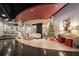Festive apartment lobby with holiday decorations, seating area, and decorated Christmas tree at 115 W Peachtree Nw Pl # 713, Atlanta, GA 30313