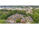 Stunning aerial view of a neighborhood with tree-lined streets and well-maintained homes near the city at 11945 Dancliff Trce, Alpharetta, GA 30009