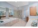 Spacious bathroom featuring a soaking tub, glass shower, and double vanity at 11945 Dancliff Trce, Alpharetta, GA 30009