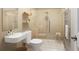 Modern bathroom featuring a frameless glass shower, floating vanity, and heated towel rack at 11945 Dancliff Trce, Alpharetta, GA 30009