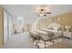 Bright bedroom featuring a ceiling fan and decoratively angled ceilings at 11945 Dancliff Trce, Alpharetta, GA 30009
