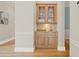 Butler's pantry with granite countertop, storage cabinets, and an undermount sink at 11945 Dancliff Trce, Alpharetta, GA 30009