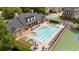 Aerial view of the community pool features ample seating, and well-maintained landscaping at 11945 Dancliff Trce, Alpharetta, GA 30009