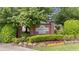 Community sign for Academy Park with brick pillars and lush landscaping at 11945 Dancliff Trce, Alpharetta, GA 30009