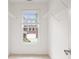 Clean walk-in closet with window and ample wire shelving at 11945 Dancliff Trce, Alpharetta, GA 30009