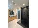 Modern bathroom with dual sinks, sleek vanity, glass shower, and recessed lighting at 1323 Peachtree Ne Vw, Atlanta, GA 30319