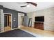 Spacious bedroom with exposed brick wall, hardwood floors, and modern ceiling fan at 1323 Peachtree Ne Vw, Atlanta, GA 30319